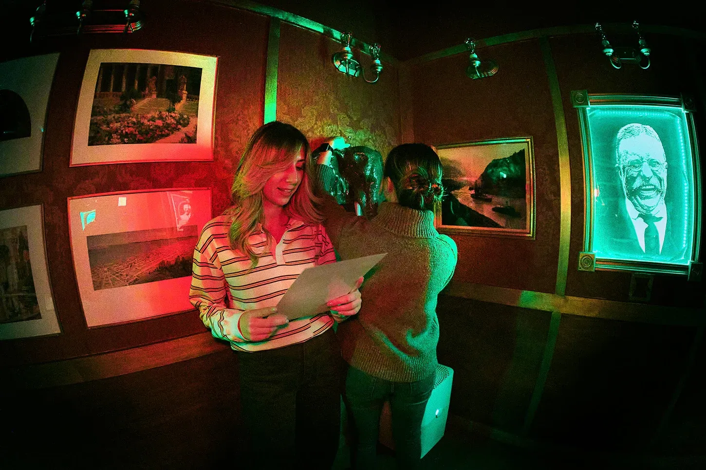 Two players reading a clue in the Roosevelt Escape Room